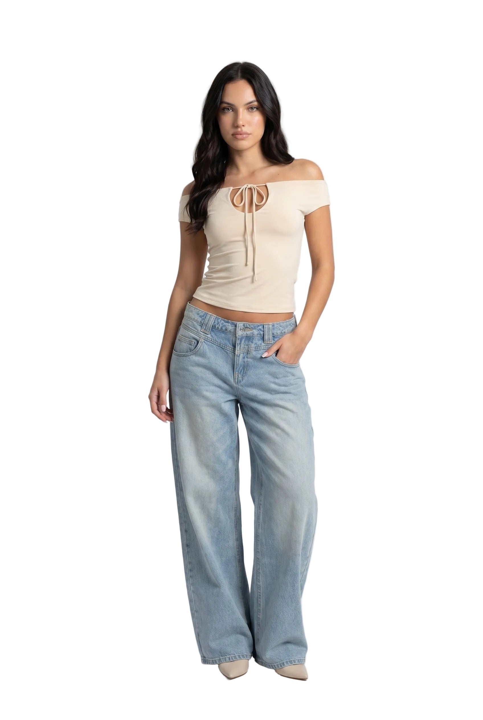 Woman wearing a beige off-shoulder top and light blue jeans on a white background